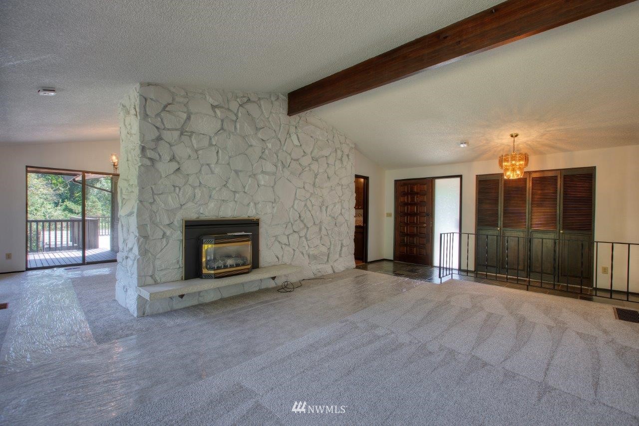 22004 Southeast Bain Road Renton, WA 98058 - Photo 5 of 27 a view of a livingroom with a fireplace