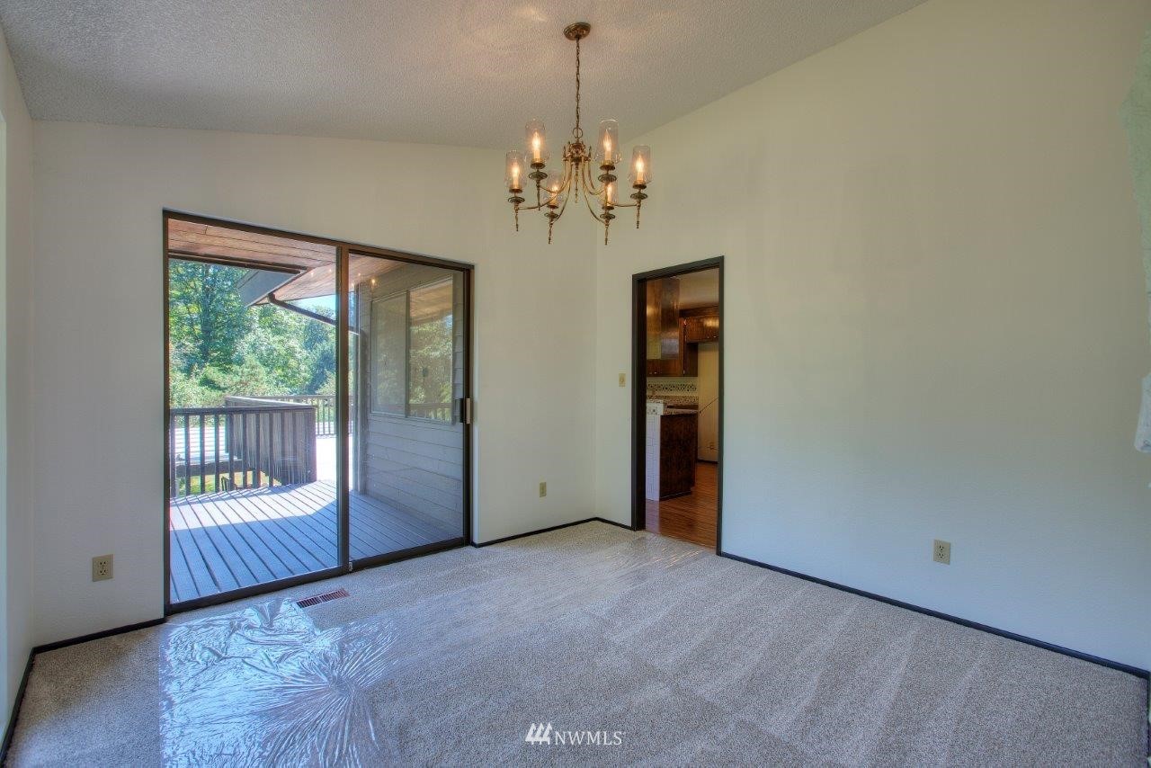 22004 Southeast Bain Road Renton, WA 98058 - Photo 7 of 27 a view of an empty room with a window