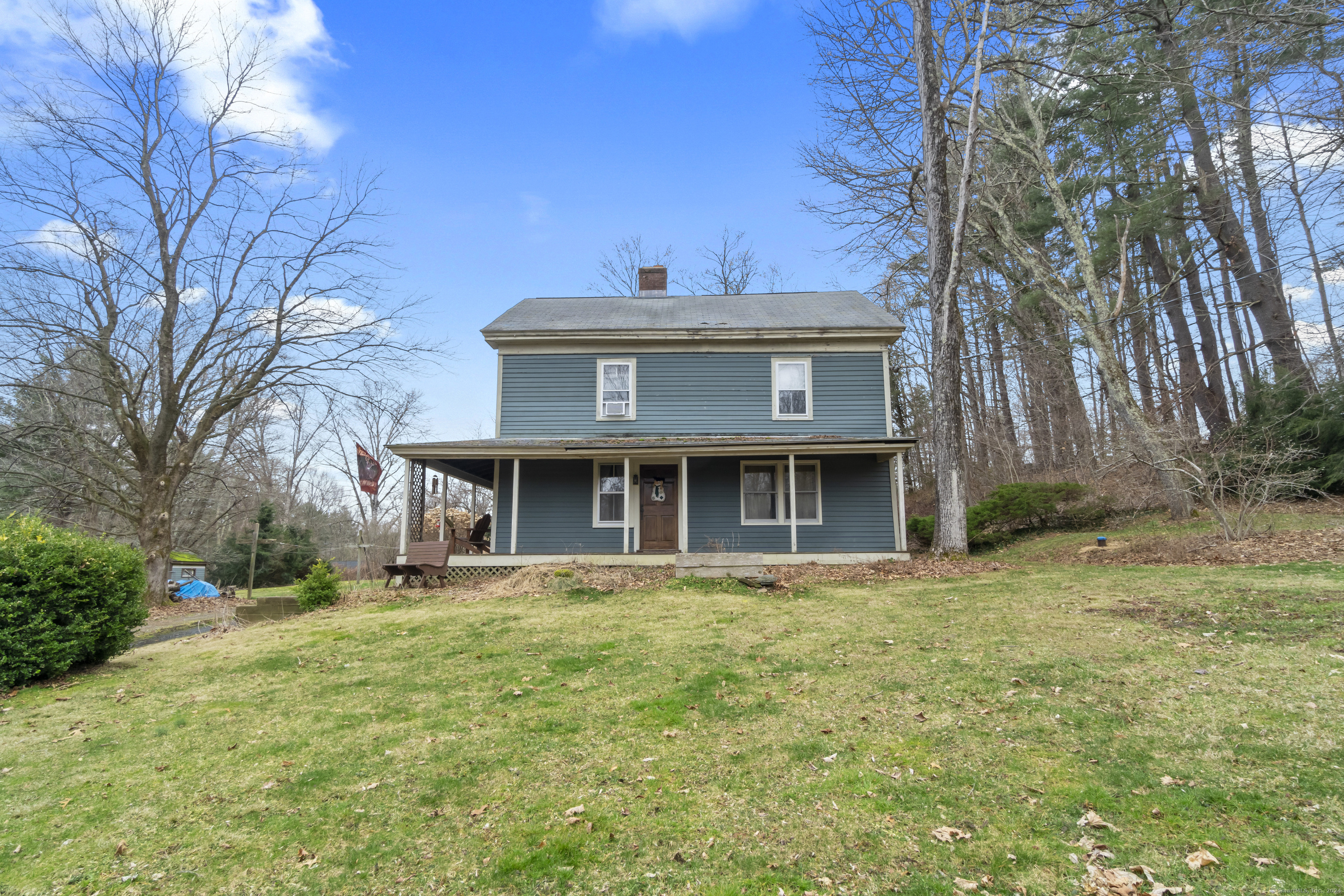143 Center Hill Road Barkhamsted, CT 06063 - Photo 1 of 1 a front view of a house with a garden