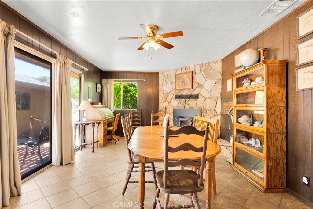 5500 Oil Well Road Phelan, CA 92371 - Photo 10 of 65 a dining room with furniture and a floor to ceiling window