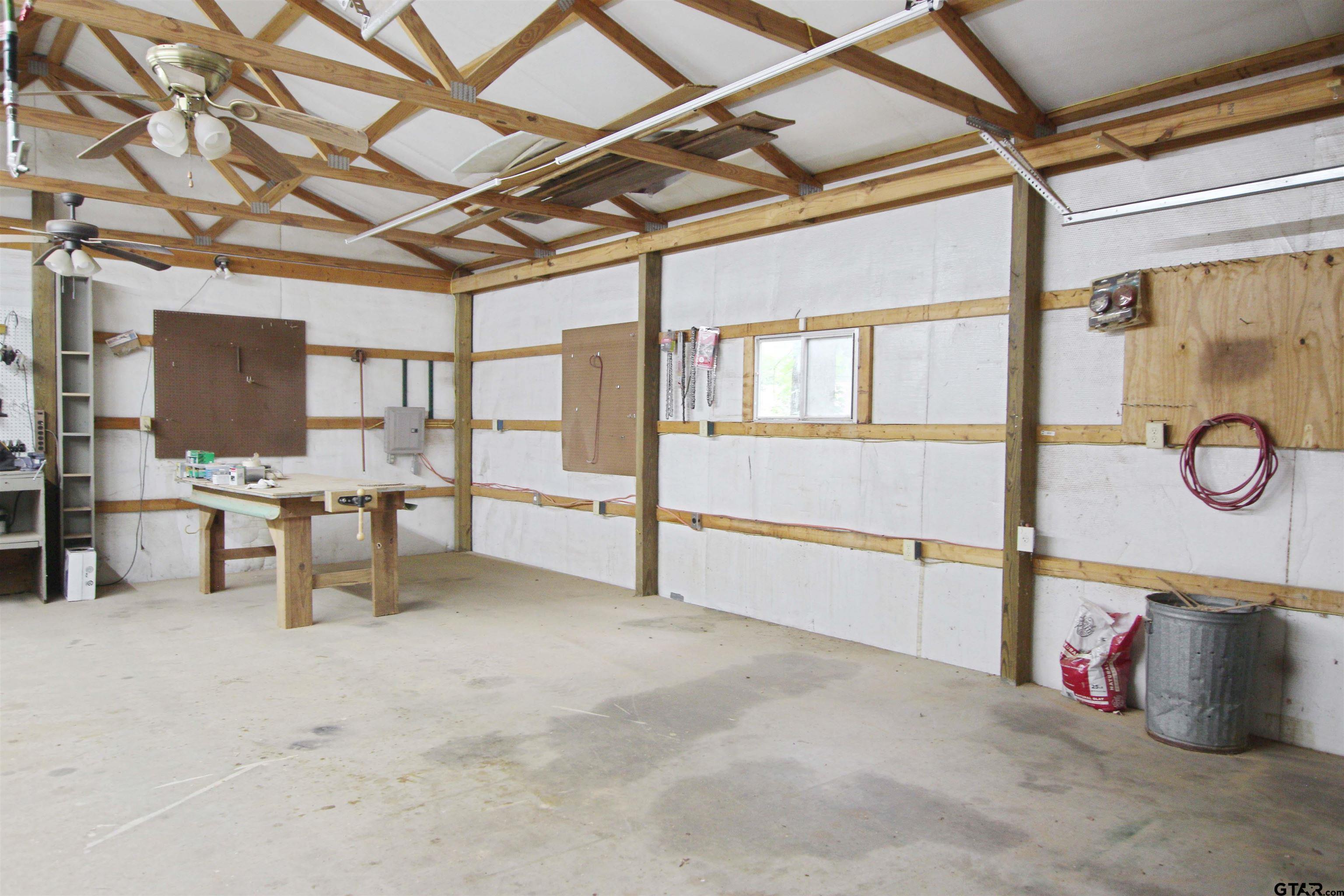782 Rosie Wady Road Gladewater, TX 75647 - Photo 31 of 48 a view of an empty room with wooden floor