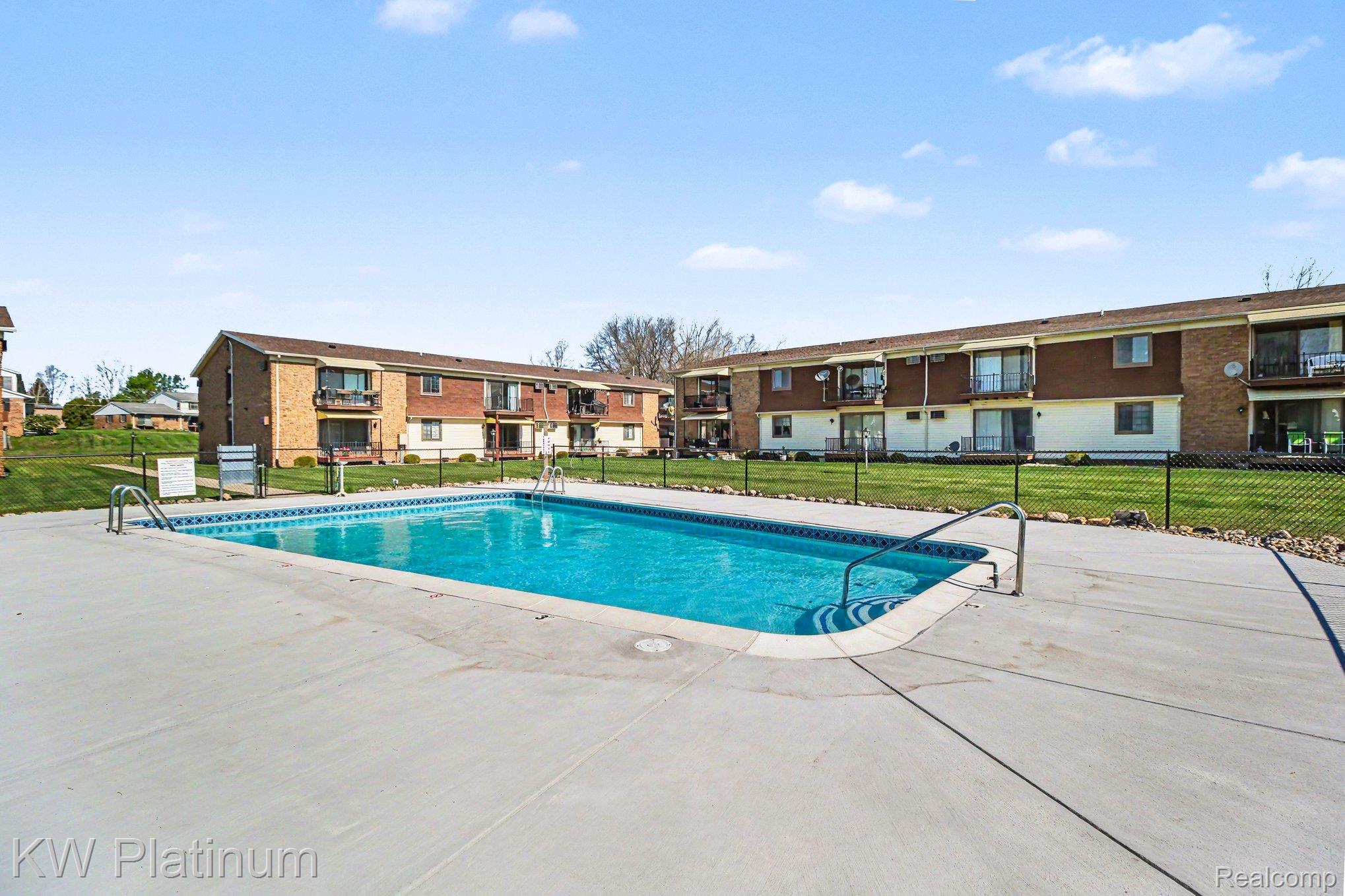 1900 River Road, Unit C5 Marysville, MI 48040 - Photo 3 of 15 Community pool with a patio