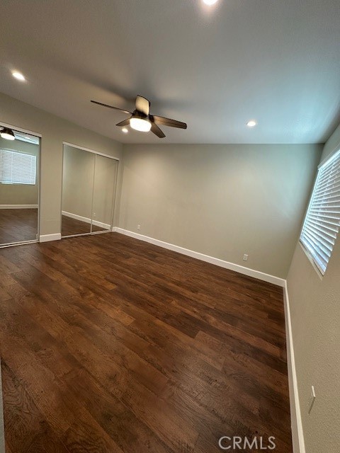 44649 La Paz Road, Unit F Temecula, CA 92592 - Photo 14 of 23 an empty room with wooden floor and windows
