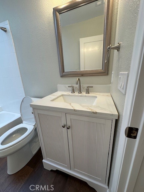 44649 La Paz Road, Unit F Temecula, CA 92592 - Photo 16 of 23 a bathroom with a sink a toilet and a mirror