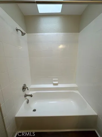 a bathroom with a sink vanity and a mirror