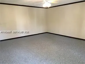 a view of a wall with an empty shelf