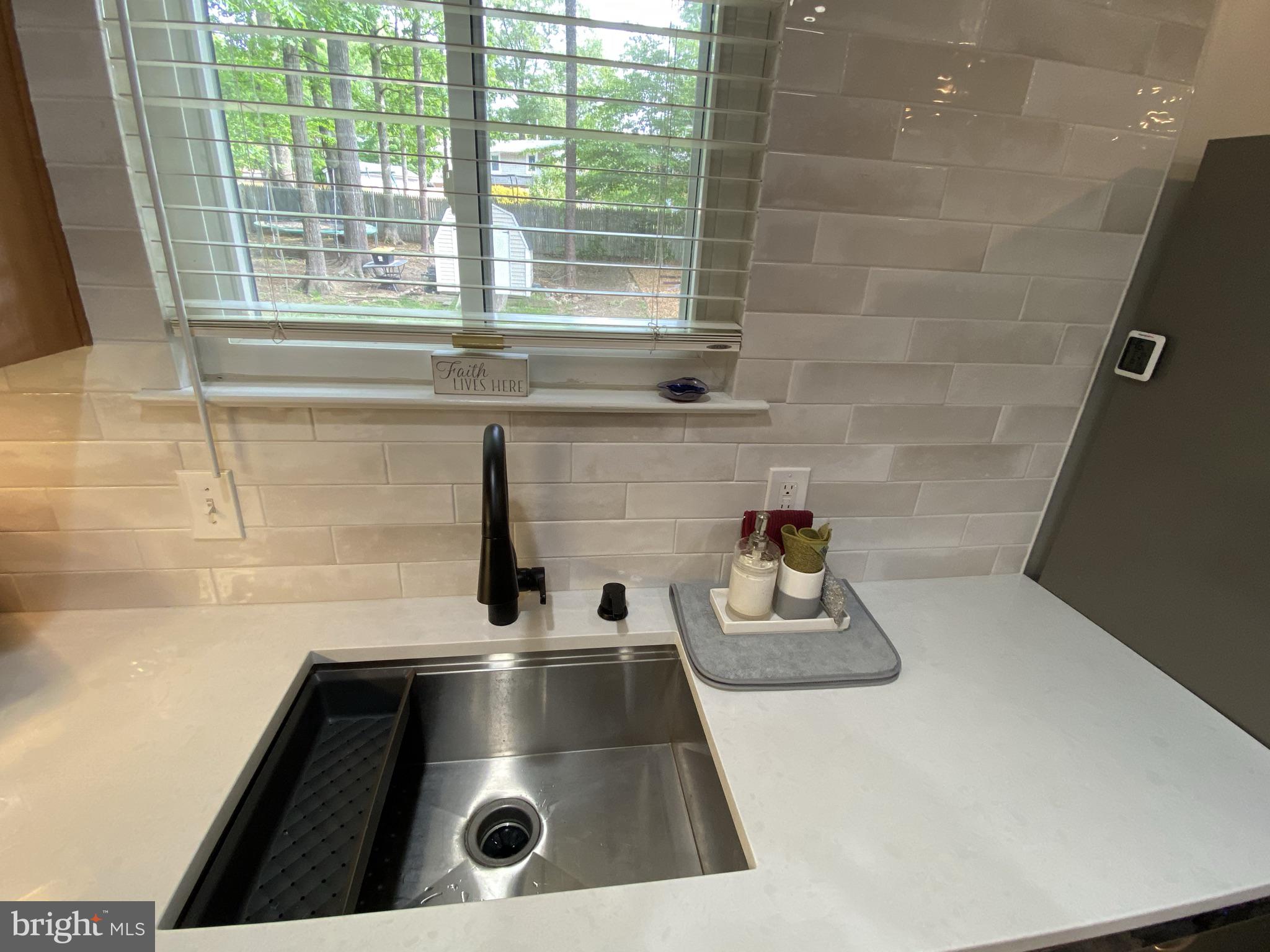 6919 Vancouver Road Springfield, VA 22152 - Photo 28 of 67 Striking Quartz Countertops , Sink and Tile work!