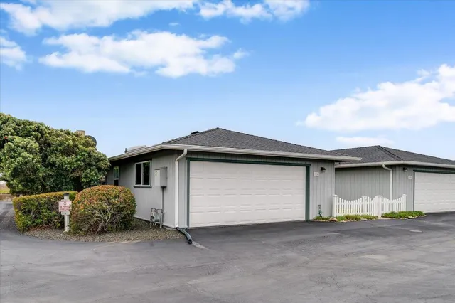 a front view of a house with a garage