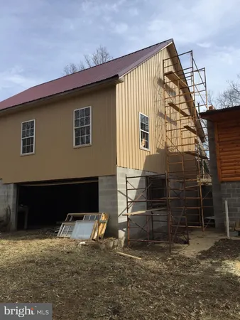 a front view of a house with parking space