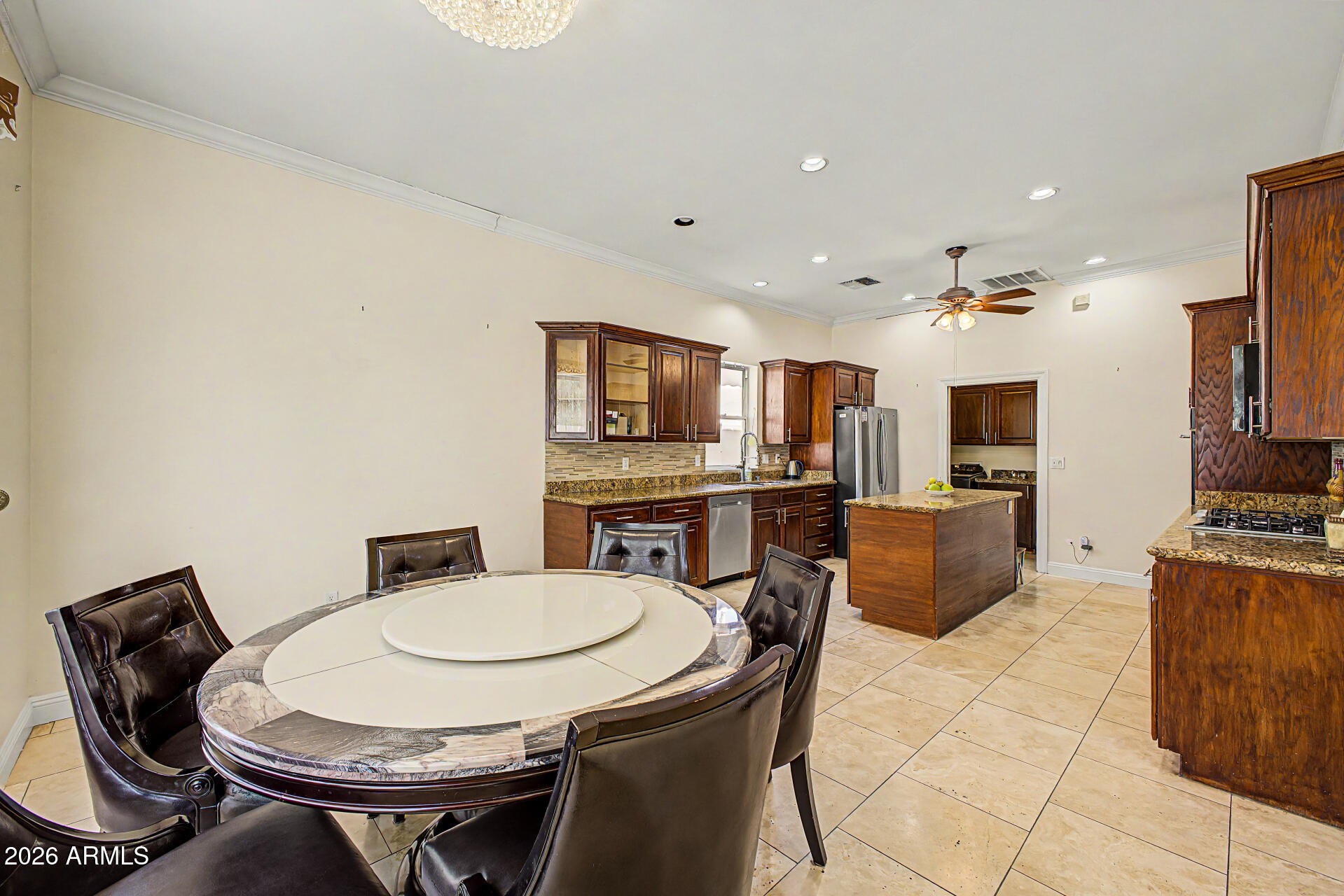 808 West Citrus Way Phoenix, AZ 85013 - Photo 10 of 35 a kitchen with stainless steel appliances a dining table and chairs