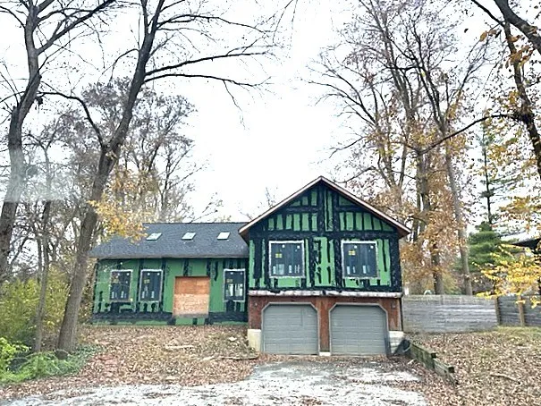 a front view of a house with garden