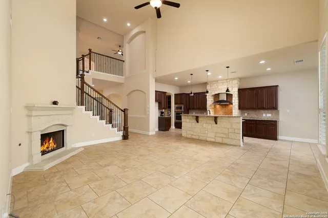 a view of kitchen with furniture and a fireplace