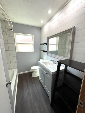 a view of bathroom with a sink and mirror