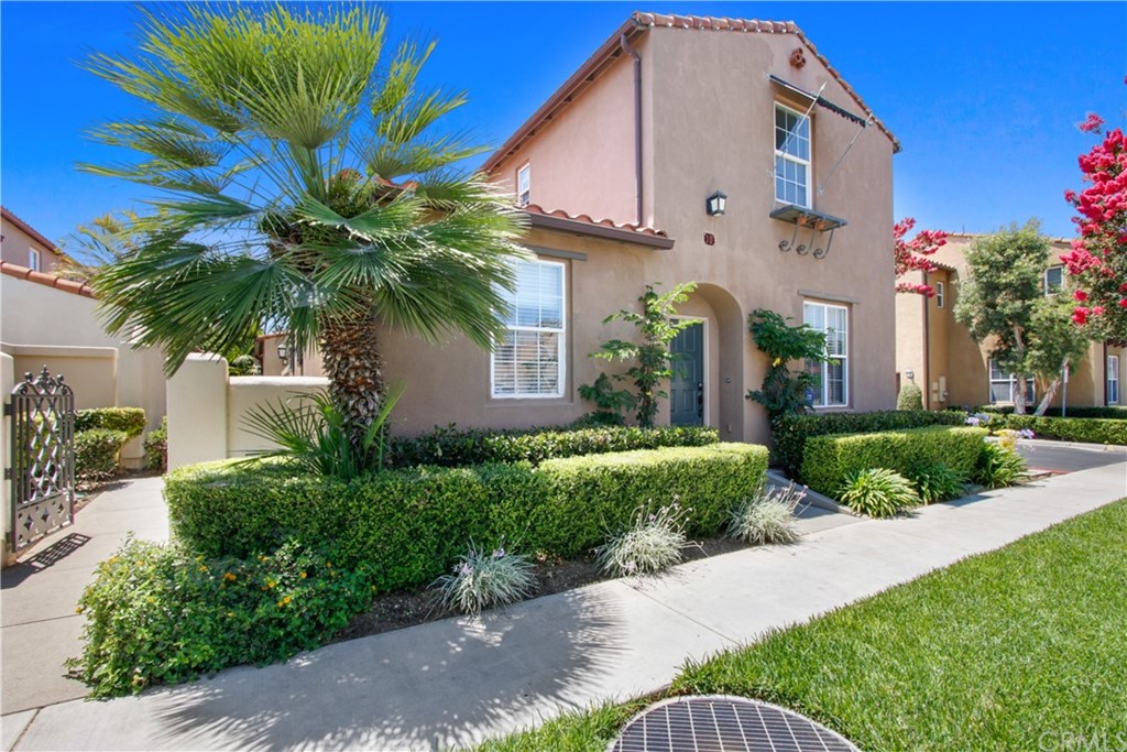 a front view of house with small garden