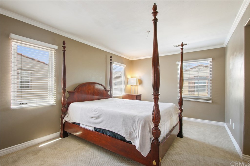 10 Alevera Irvine, CA 92618 - Photo 12 of 22 a bedroom with a bed next to a window