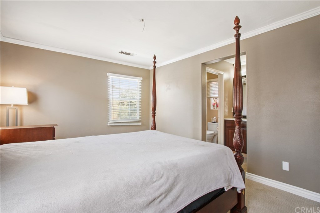 10 Alevera Irvine, CA 92618 - Photo 13 of 22 a bedroom with a bed and a mirror