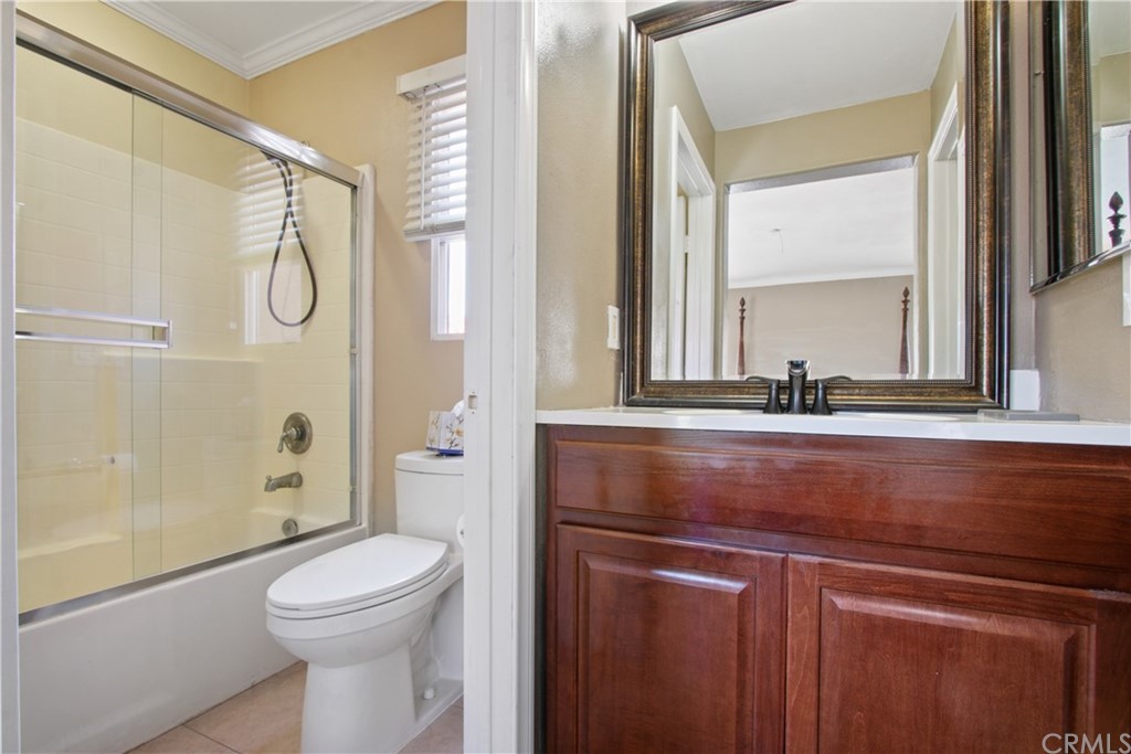 10 Alevera Irvine, CA 92618 - Photo 14 of 22 a bathroom with a sink a toilet and shower
