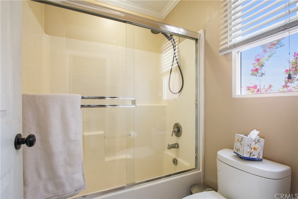 10 Alevera Irvine, CA 92618 - Photo 15 of 22 a bathroom with a shower and a toilet