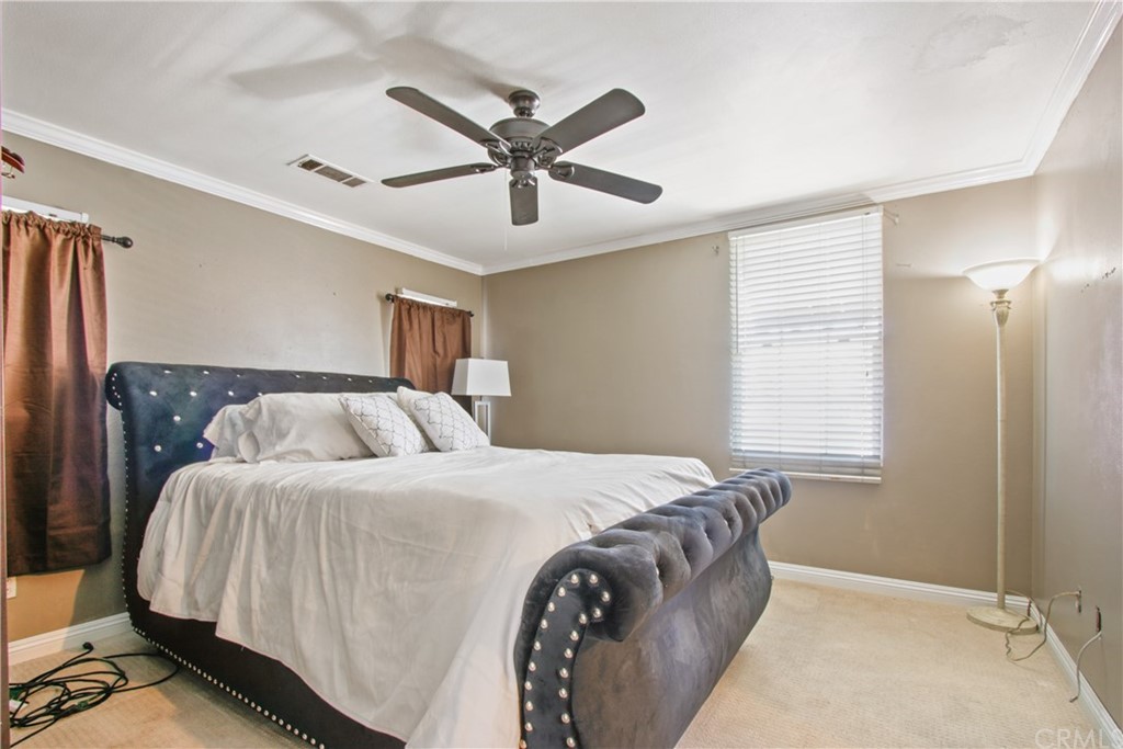 10 Alevera Irvine, CA 92618 - Photo 16 of 22 a bedroom with a large bed and a window