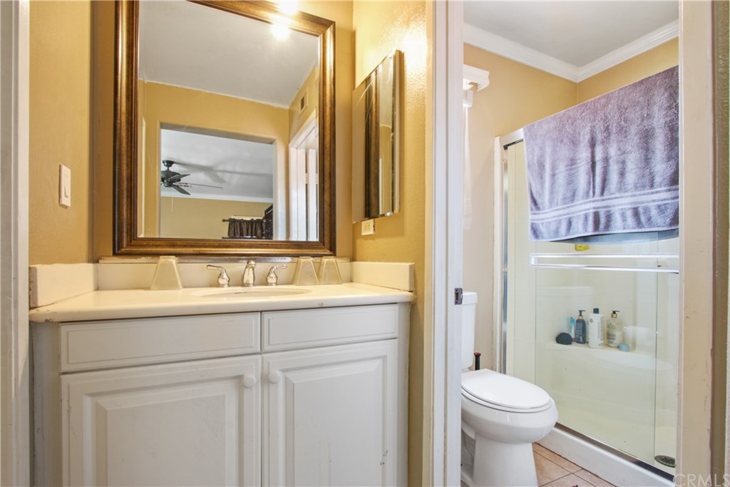 10 Alevera Irvine, CA 92618 - Photo 18 of 22 a bathroom with a sink a toilet and a mirror