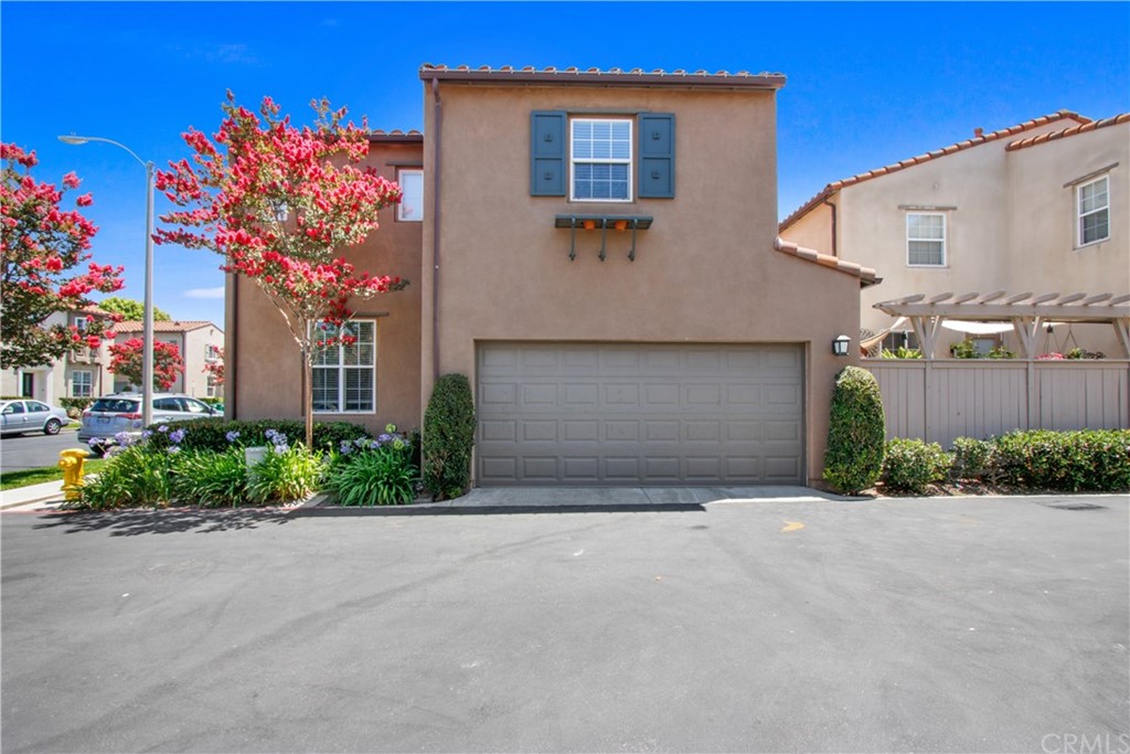 10 Alevera Irvine, CA 92618 - Photo 22 of 22 a front view of a house with a yard and garage