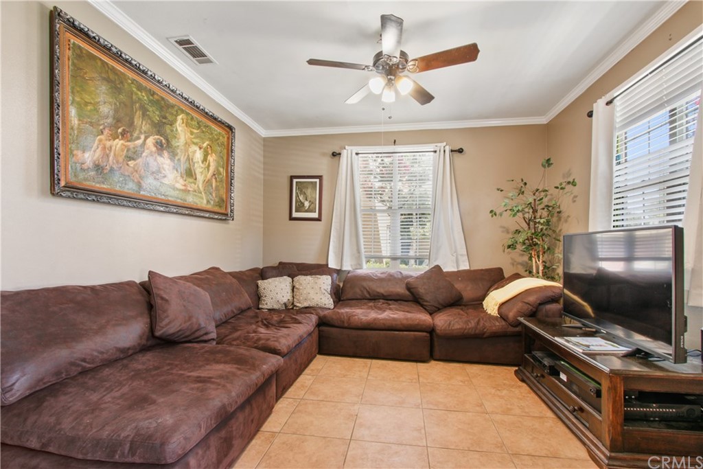 10 Alevera Irvine, CA 92618 - Photo 4 of 22 a living room with furniture and a flat screen tv