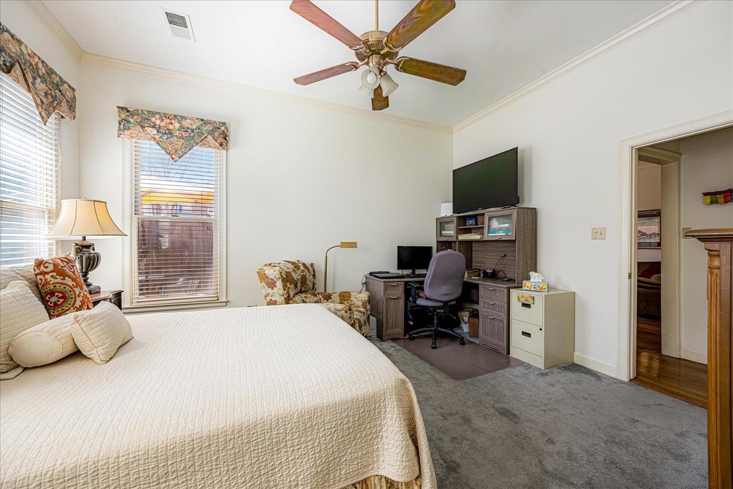 1727 Village Ridge Road Collierville, TN 38017 - Photo 11 of 33 a bedroom with a bed and a flat screen tv