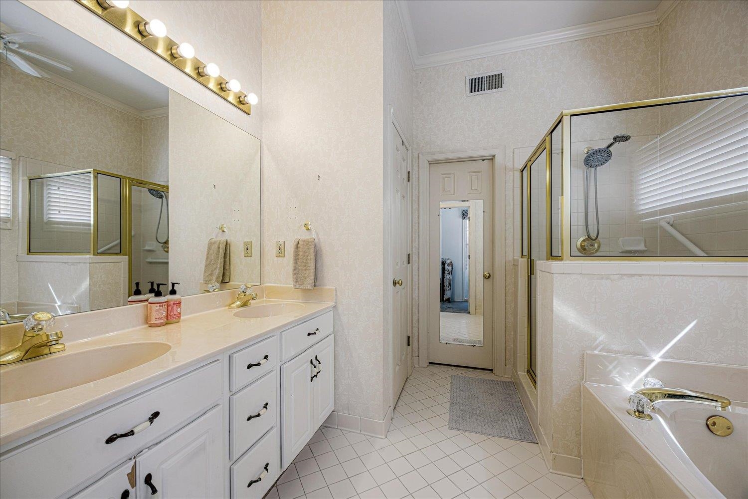 1727 Village Ridge Road Collierville, TN 38017 - Photo 12 of 33 a spacious bathroom with a double vanity sink a mirror and a shower