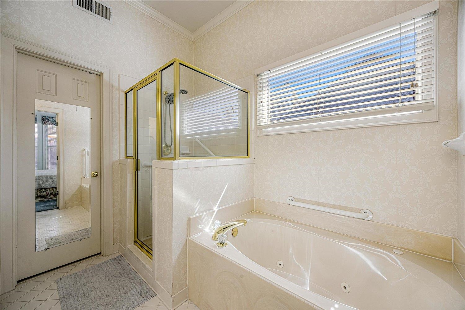 1727 Village Ridge Road Collierville, TN 38017 - Photo 13 of 33 a bathroom with a bathtub and a shower