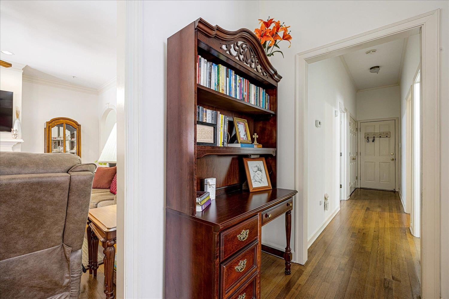 1727 Village Ridge Road Collierville, TN 38017 - Photo 19 of 33 a living room with furniture and a book shelf