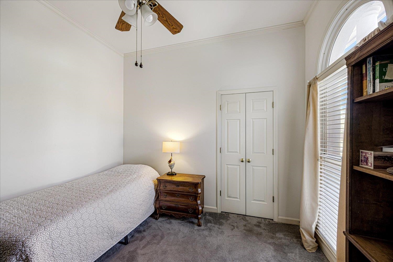 1727 Village Ridge Road Collierville, TN 38017 - Photo 22 of 33 a spacious bedroom with a bed and a flat tv screen on a dresser