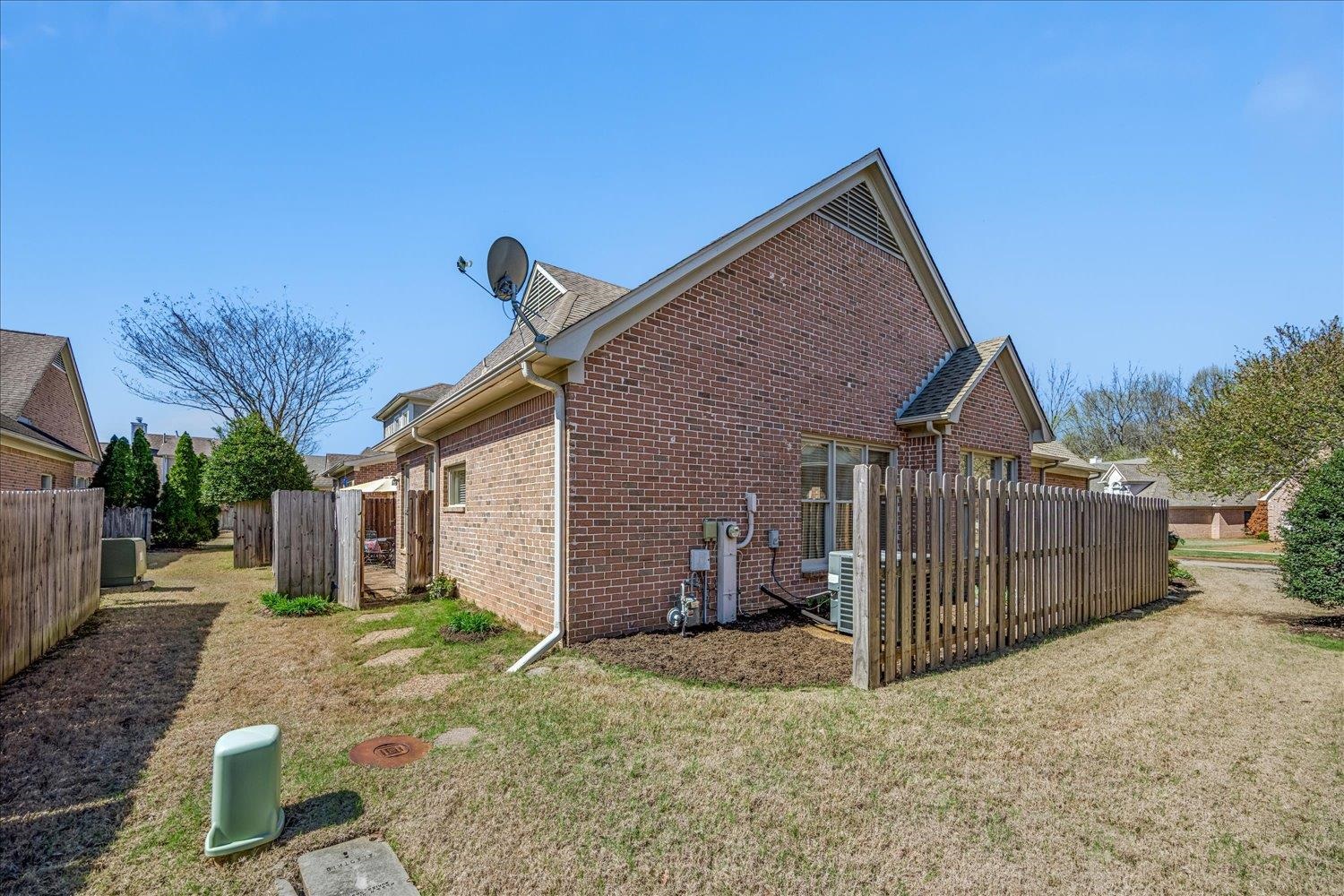 1727 Village Ridge Road Collierville, TN 38017 - Photo 30 of 33 a view of a house with a yard and wooden fence