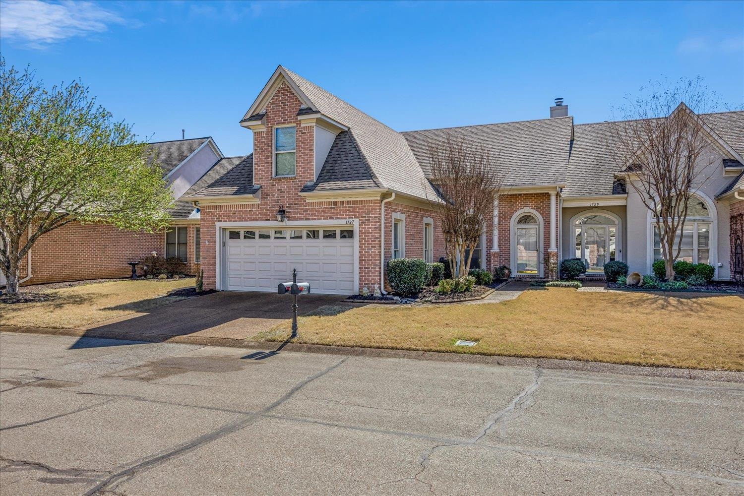 1727 Village Ridge Road Collierville, TN 38017 - Photo 3 of 33 front view of a house with a yard