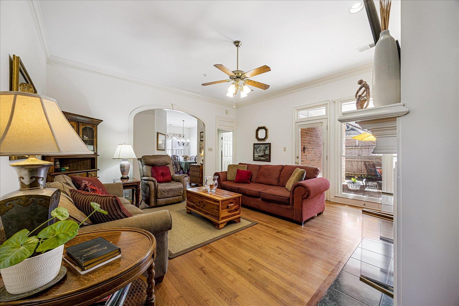 1727 Village Ridge Road Collierville, TN 38017 - Photo 6 of 33 a living room with furniture a fireplace and a chandelier