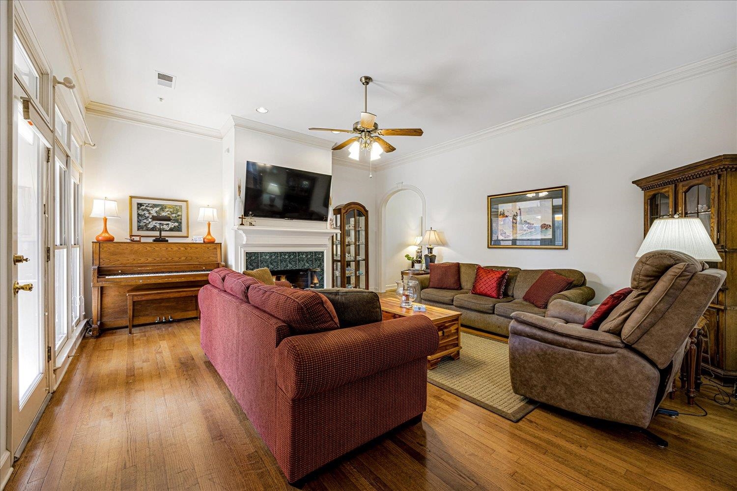 1727 Village Ridge Road Collierville, TN 38017 - Photo 8 of 33 a living room with furniture a flat screen tv and a fireplace