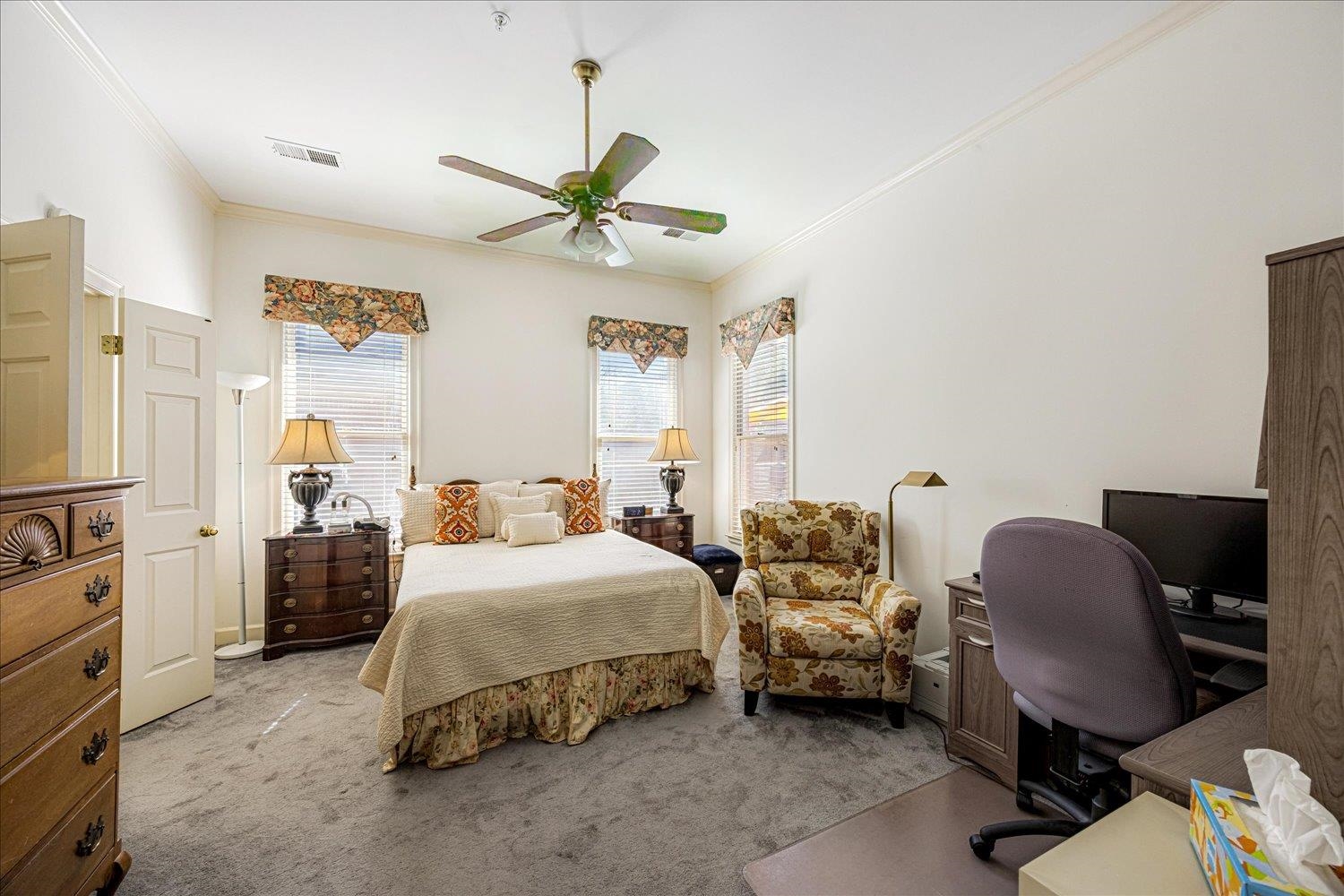 1727 Village Ridge Road Collierville, TN 38017 - Photo 9 of 33 a bedroom with a bed a chair and a chandelier