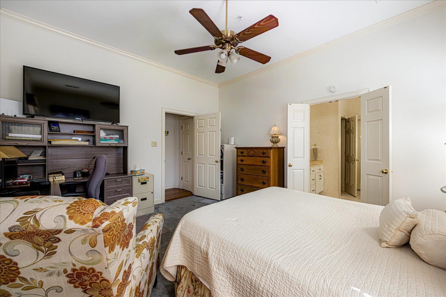 1727 Village Ridge Road Collierville, TN 38017 - Photo 10 of 33 a bedroom with a bed and a flat screen tv