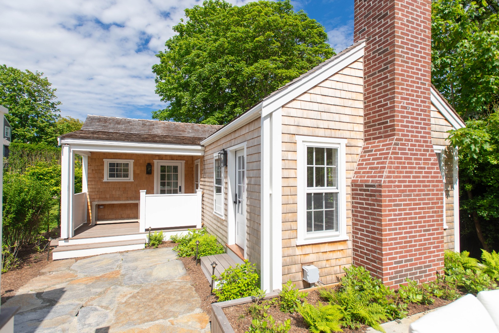 10 Silver Street Nantucket, MA 02554 - Photo 7 of 48 a front view of a house with garden
