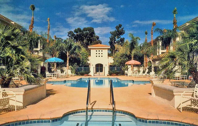 a swimming pool with outdoor seating and yard