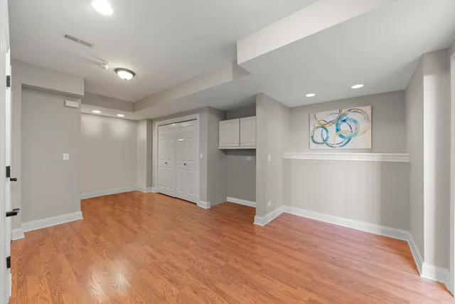 a bathroom with a shower and a sink