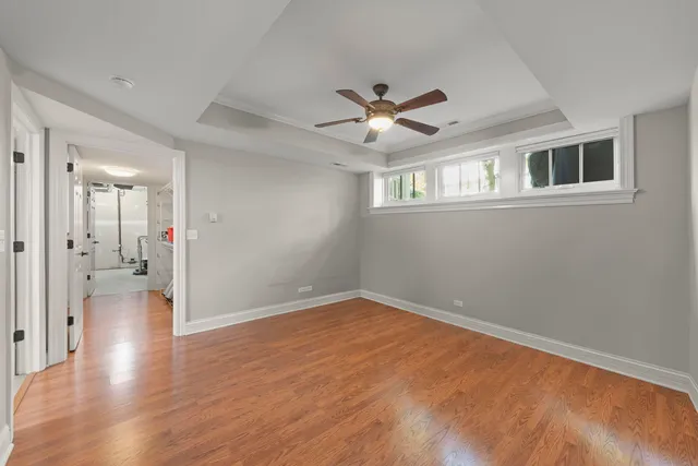a view of a patio with a table and chairs and floor to ceiling window
