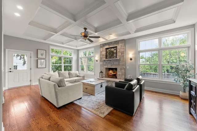 a living room with fireplace furniture and a flat screen tv