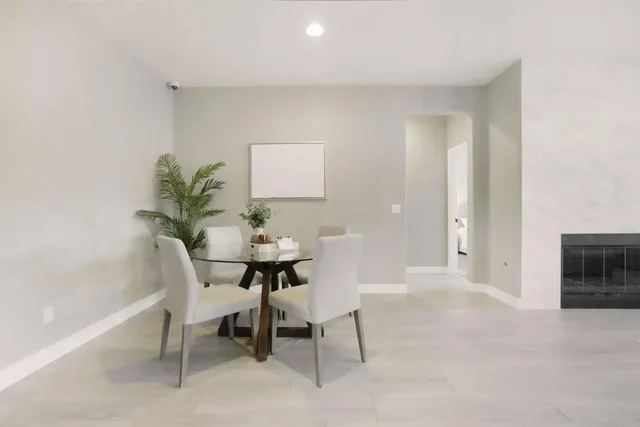 a view of a livingroom with furniture and a potted plant