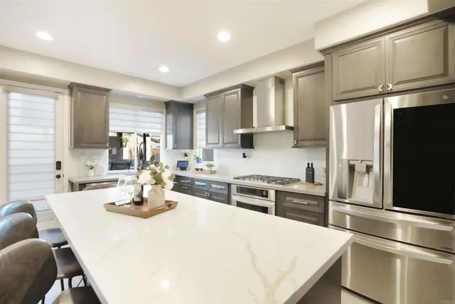 a living room with a flat screen tv and a fireplace