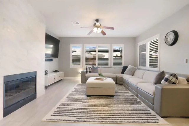 a bedroom with a bed next to a window