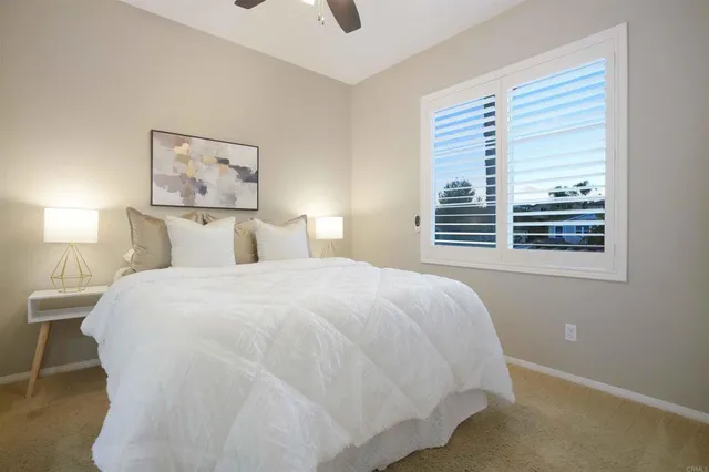 a bathroom with double vanity sinks and a mirror