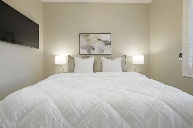 a white toilet sitting next to a bathroom sink