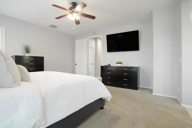 a bath tub sitting next to a bathroom sink