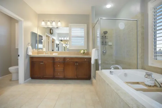 a white toilet sitting next to a window