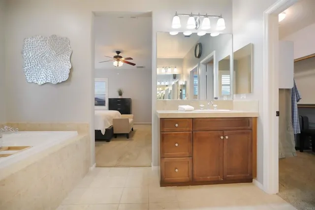 a view of a patio with table and chairs near a barbeque